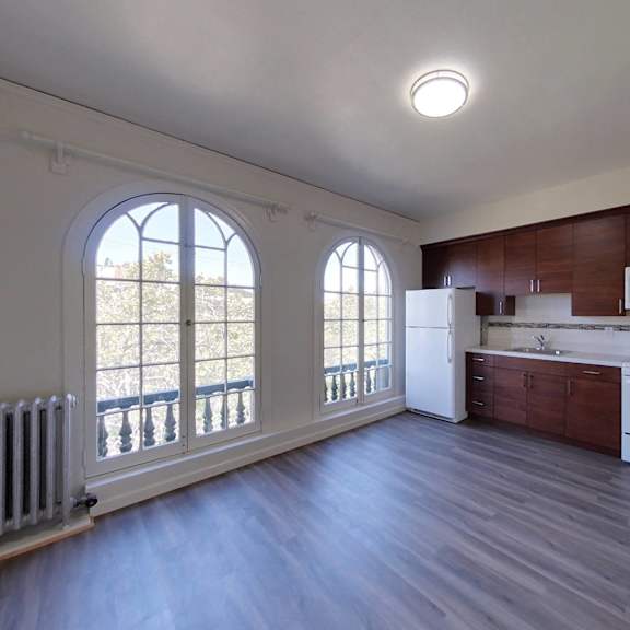 a kitchen with white appliances and wood cabinets.