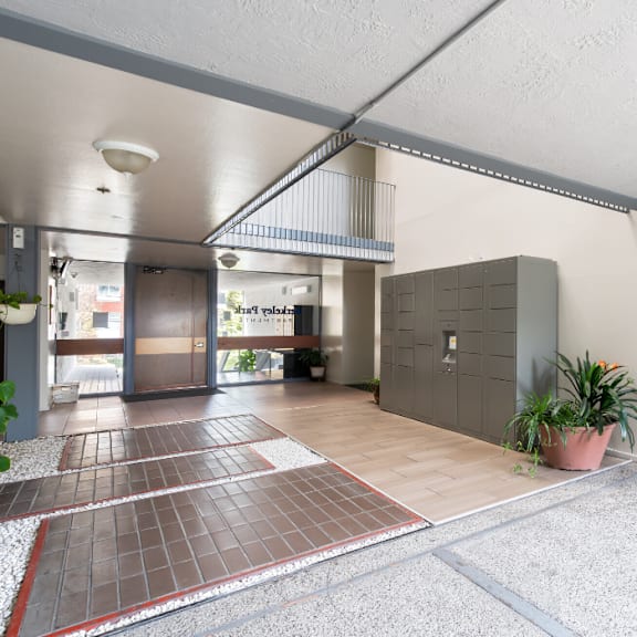 the entrance to a building with a lobby and a blue door