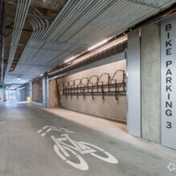 a parking garage with cars parked in it