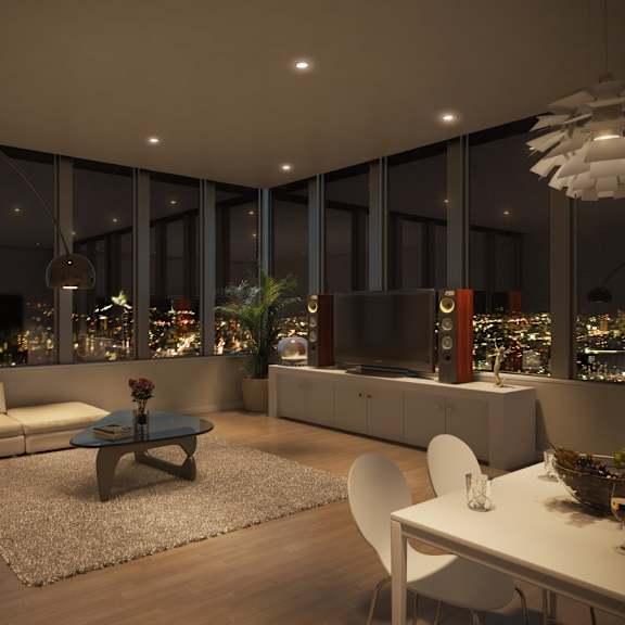 a modern living room with a view of the city at night.