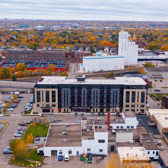 an aerial view of a city with buildings and trees