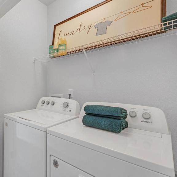 a laundry room with a washer and dryer.