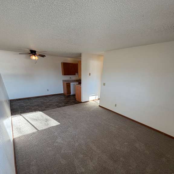a room with a white ceiling and a grey wall.