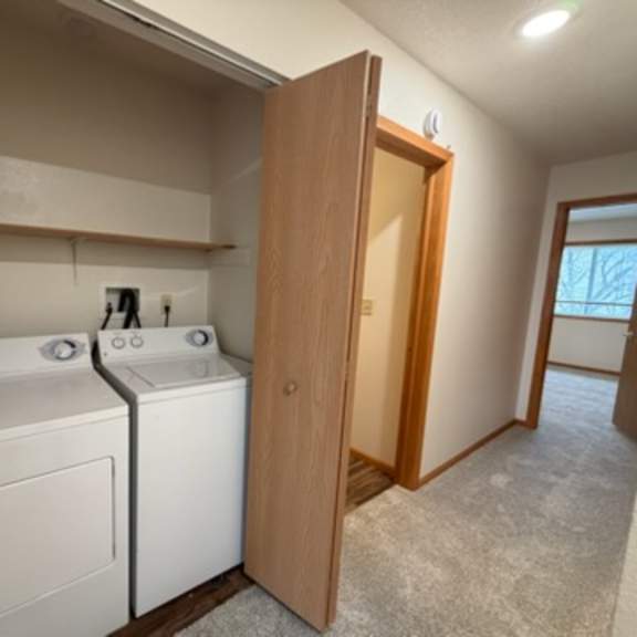 a laundry room with a washer and dryer.