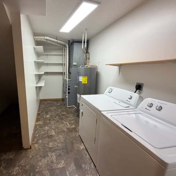 a laundry room with a washer and dryer.