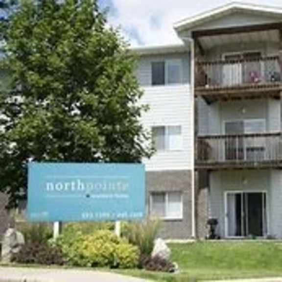 a building with a sign that says northpointe in front of it.