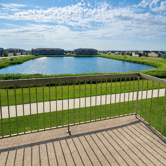 a sunny day with a clear blue sky and a river in the distance.