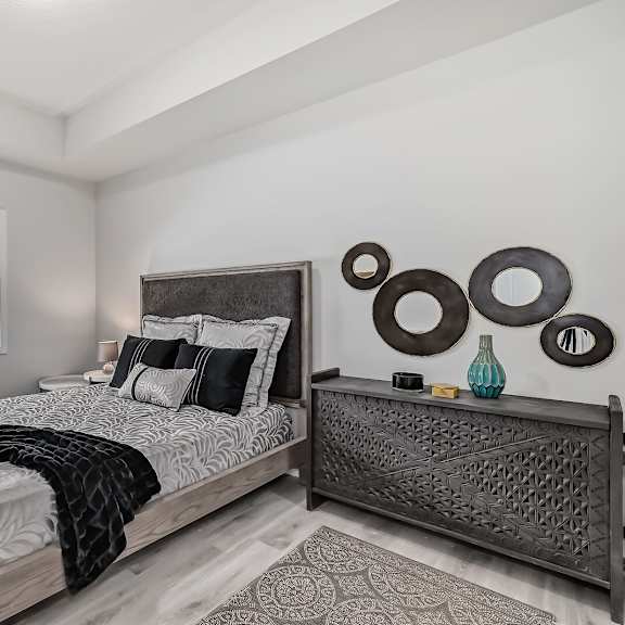 a bedroom with a large bed and a window