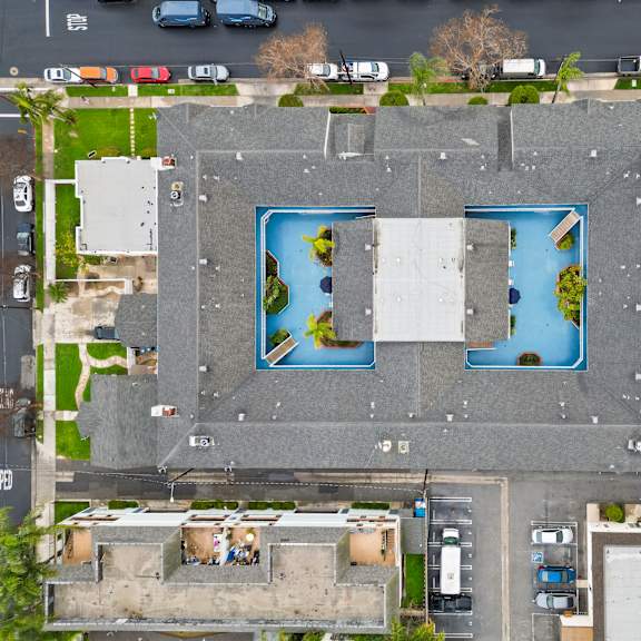 a large building with a pool in the middle of it.