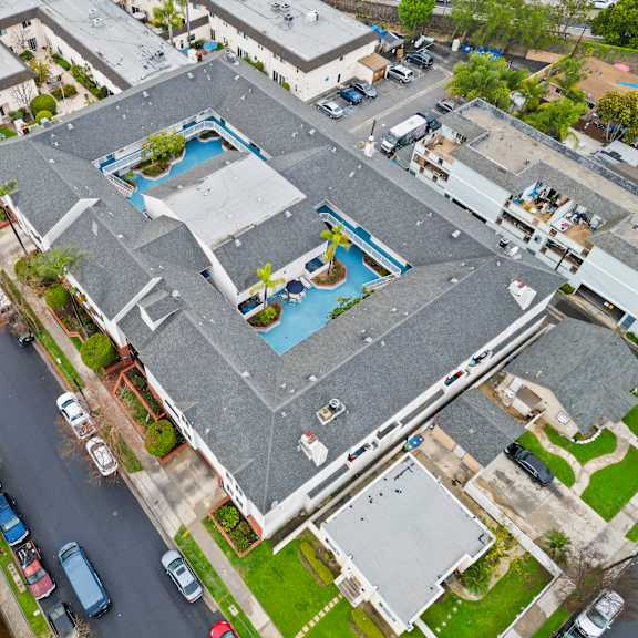 a large building with a pool in the middle of it.