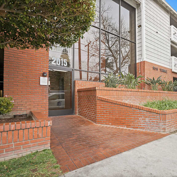 a brick wall with a sign that says "2015" on it.