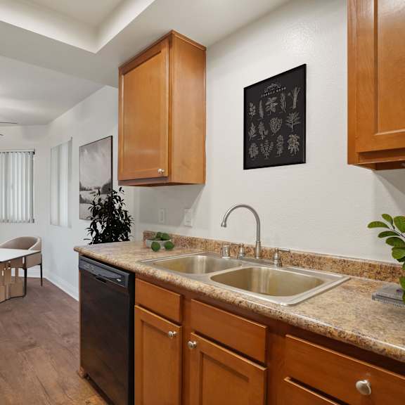a kitchen with a table and chairs in the middle of the room.