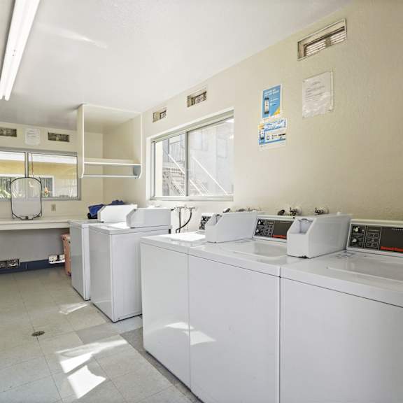 a laundromat with washers and dryers.