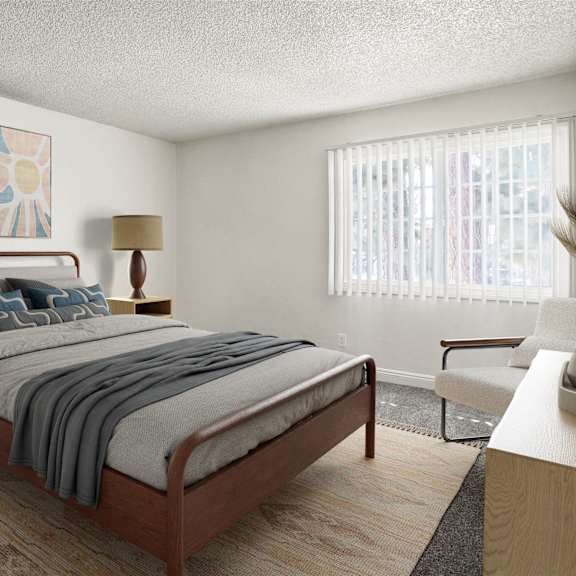 a bedroom with a bed, two lamps, and a painting on the wall.