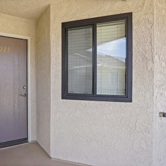 a grey door with the number 215 on it.