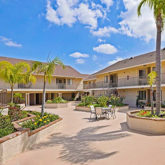 a sunny day at the courtyard of a residential building.