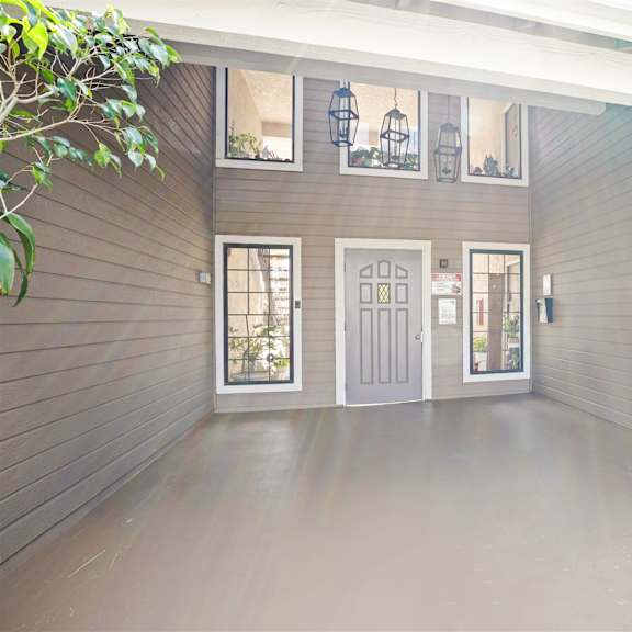 a house with a grey door and windows.