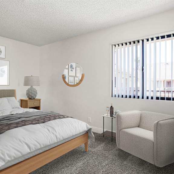 a bedroom with a bed, chair, and pictures on the wall.