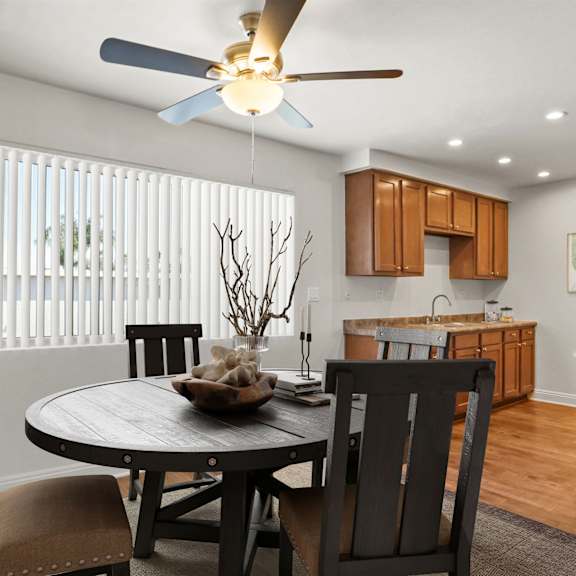 a dining room with a table and chairs.