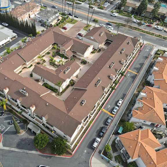 a large building with a parking lot in front of it.