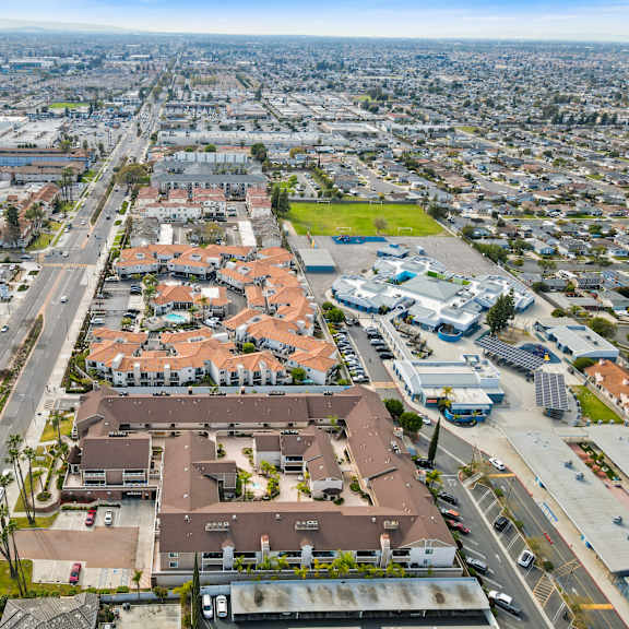 a bird's eye view of a city with a large building in the center.