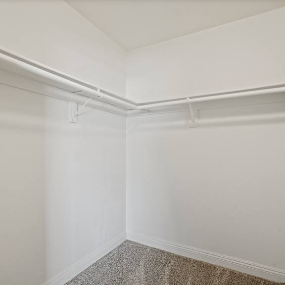 a white wall with a white shelf on top.