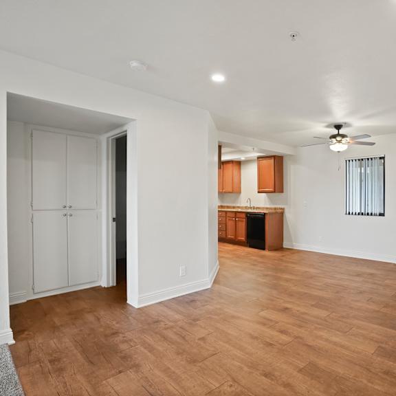 a room with wooden floors and white walls.