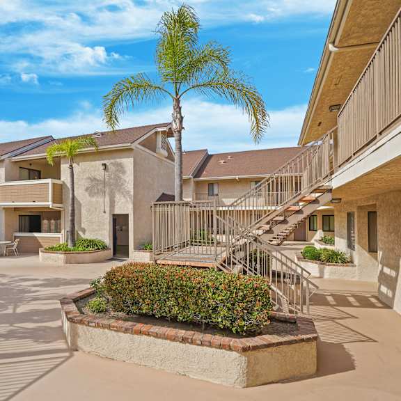 a sunny day at the courtyard of a residential building.