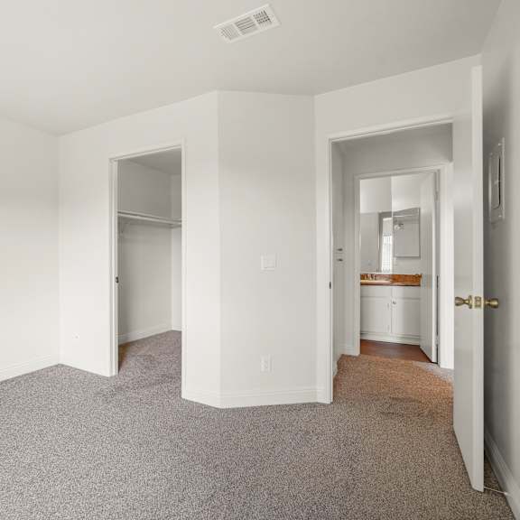 a room with carpeted floor and white walls.