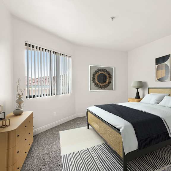 a bedroom with a bed, nightstand, and a dresser.