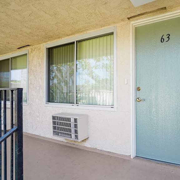 a blue door with the number 63 on it.