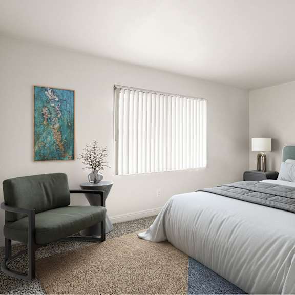 a bedroom with a large bed, a chair, and a painting on the wall.