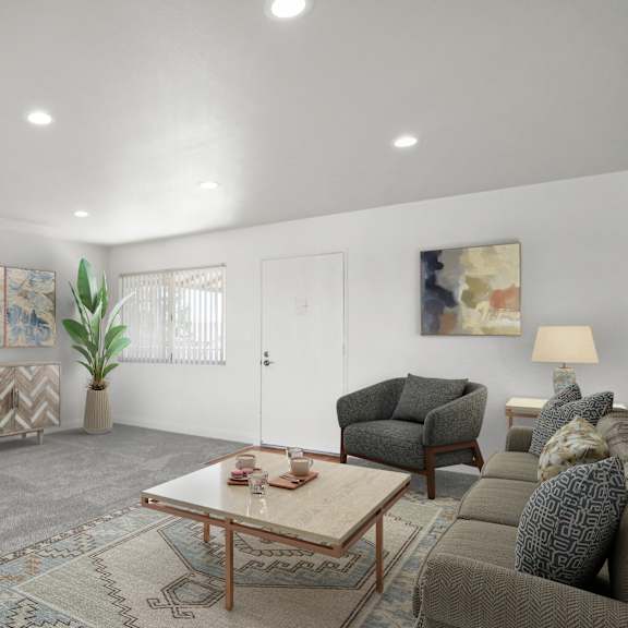 a living room with a couch, armchair, and coffee table.