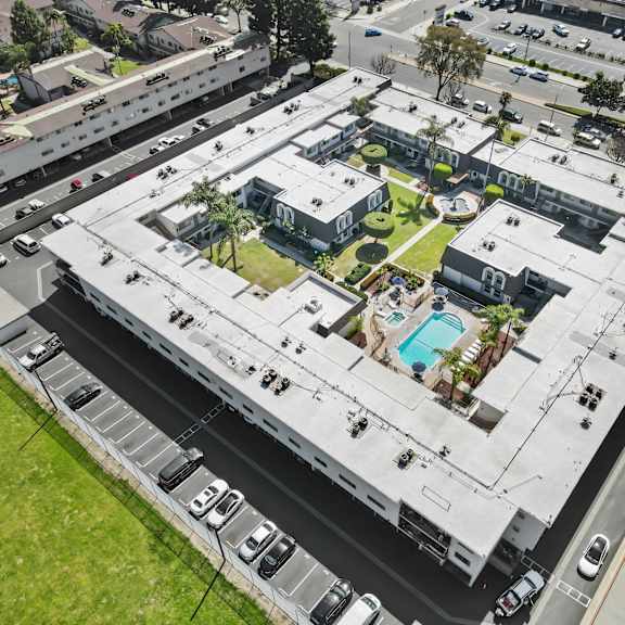 a large building with a pool in the middle of it.