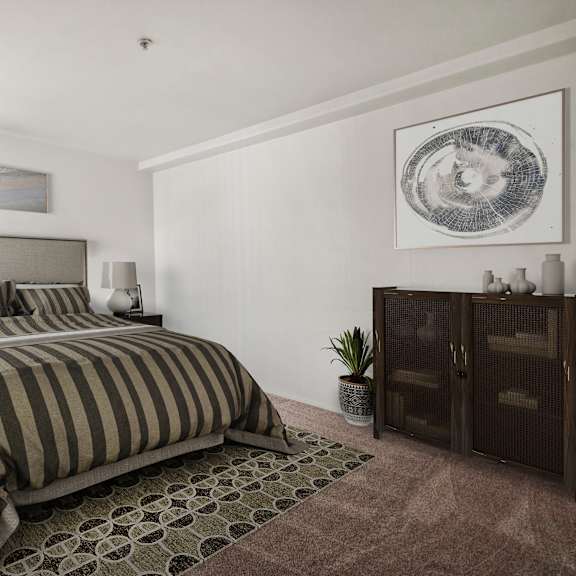 a bedroom with a large bed and a painting on the wall.