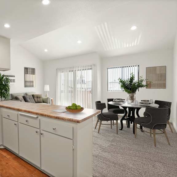 a modern kitchen with a dining area.