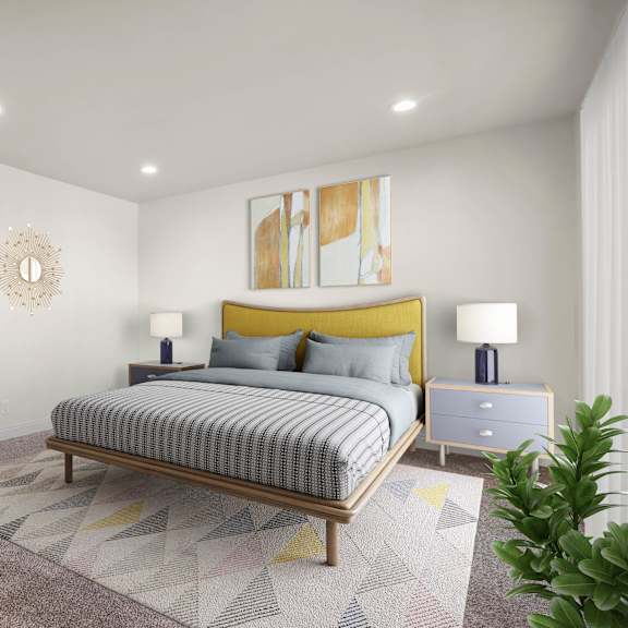 a bedroom with a bed, chair, and lamp.