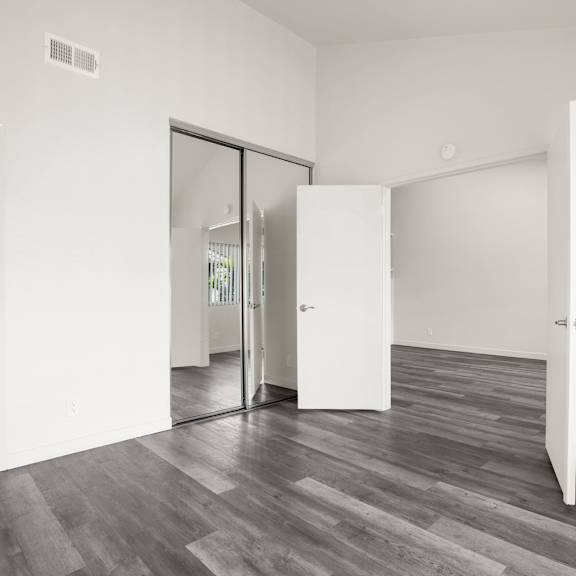 a room with a white door and a white wall.