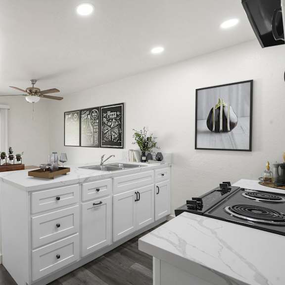 a modern kitchen with white cabinets and a marble countertop.