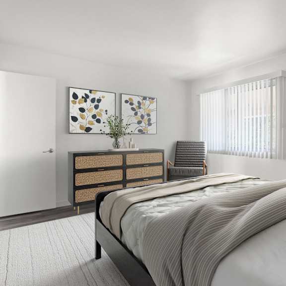 a bedroom with a bed, nightstand, and two paintings on the wall.