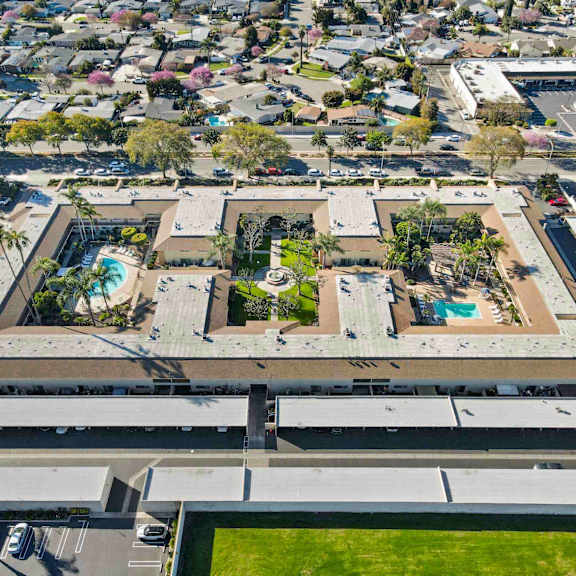 a large building with a pool in the middle of it.