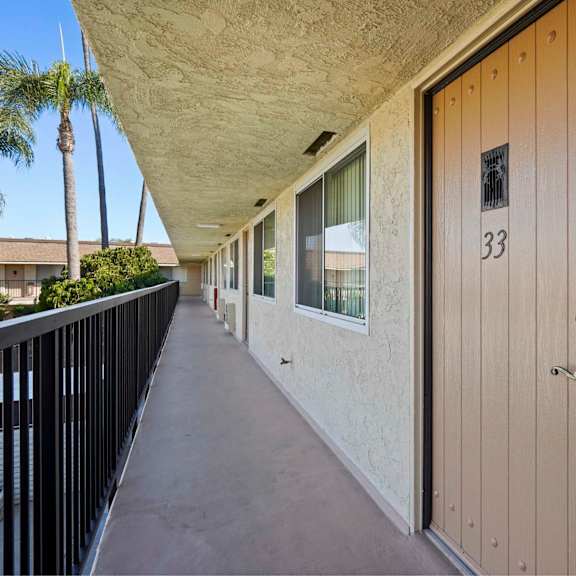 a balcony with a door numbered 33.