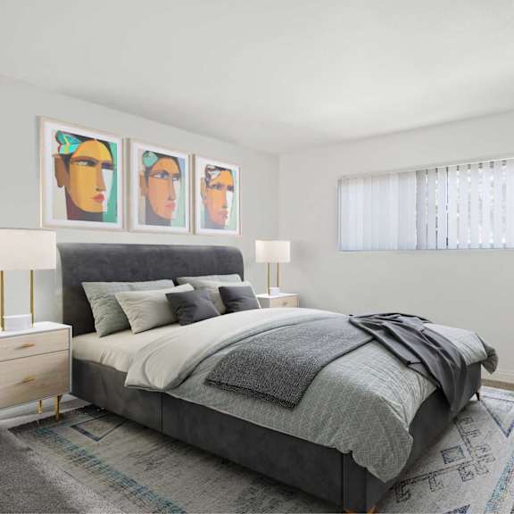 a bedroom with a bed, chair, and three framed pictures on the wall.