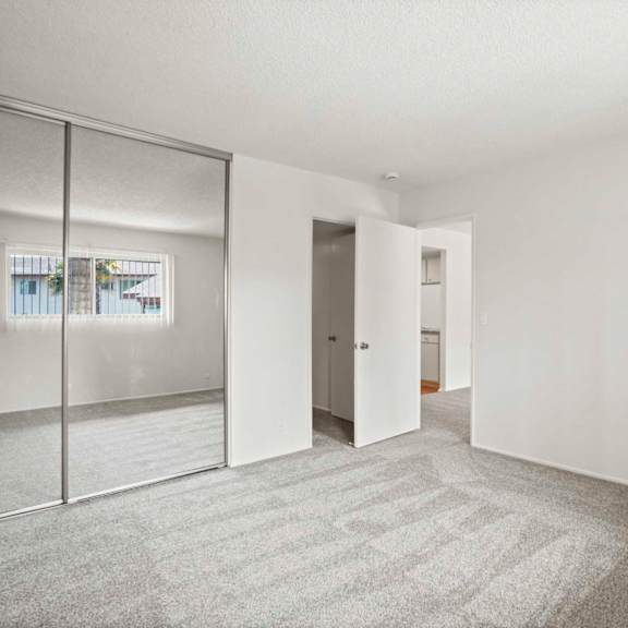 a room with a carpeted floor and white walls.