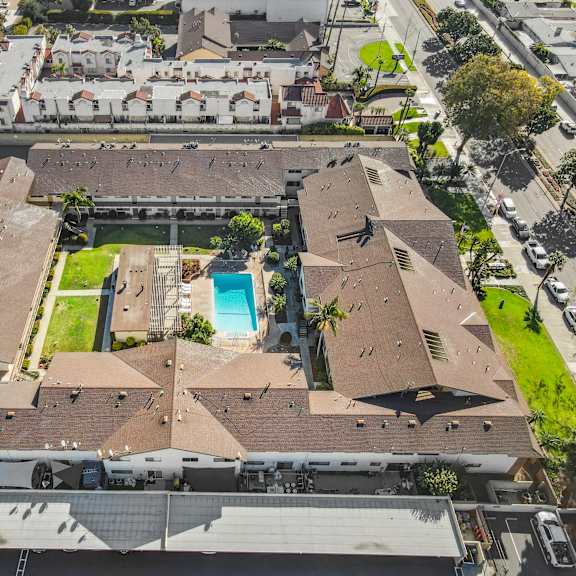 a large building with a pool in the middle of it.