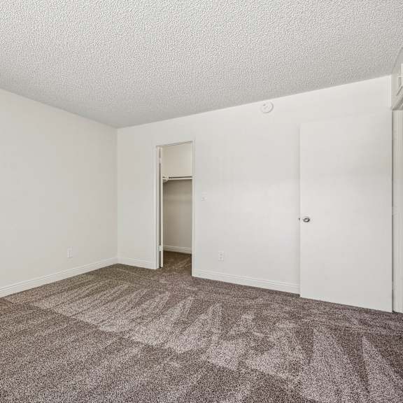 a room with a carpeted floor and white walls.