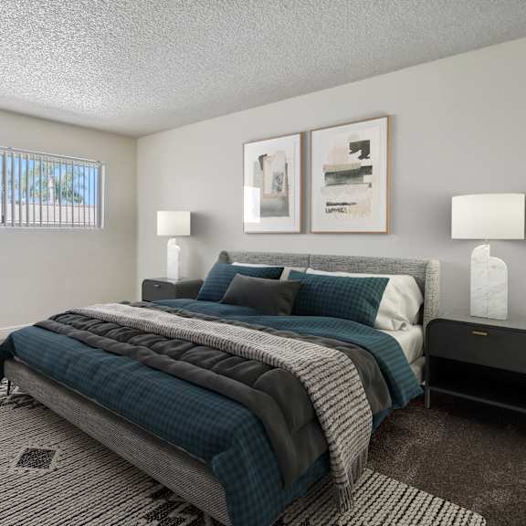 a bedroom with a large bed and a bench.