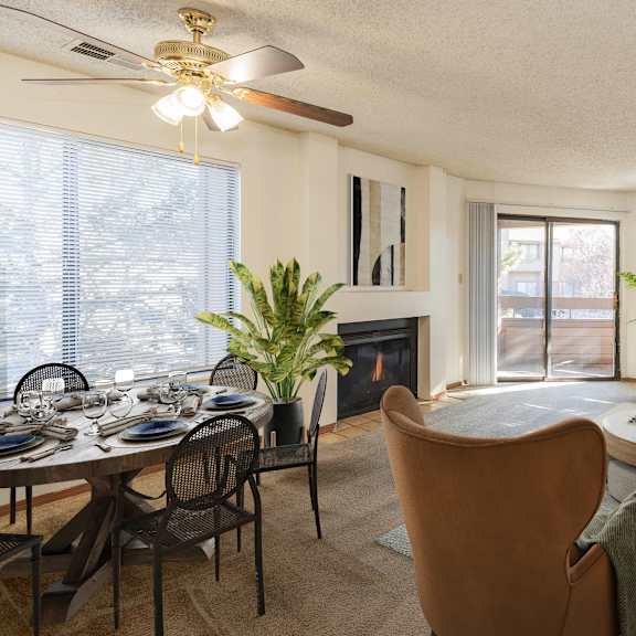a living room with a dining table and chairs.