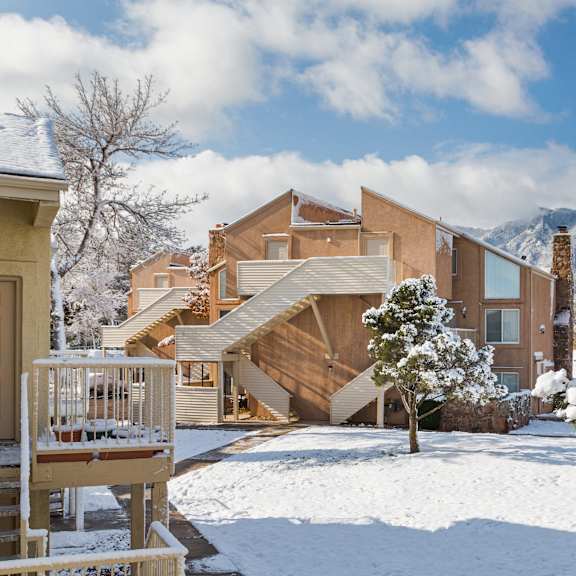 a house with a snow-covered front yard.