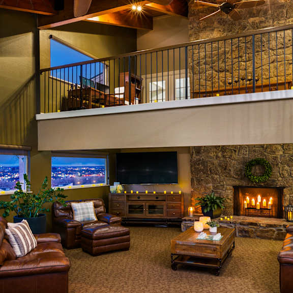 a cozy living room with a fireplace and comfortable seating.